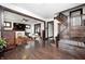 Open-concept living area with hardwood floors, fireplace, and staircase at 3356 N Park Ave, Indianapolis, IN 46205