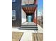 Modern front entrance with teal door, gray composite deck, and black railings at 337 N Beville Ave, Indianapolis, IN 46201