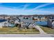 Aerial view of a suburban home featuring a pool, water views, and surrounding neighborhood at 377 Morningside Dr, Brownsburg, IN 46112