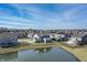 Stunning aerial view of the neighborhood, showcasing the community pond and well-maintained homes at 377 Morningside Dr, Brownsburg, IN 46112