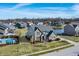 Aerial view of a suburban home featuring a pool, well-kept yard, and scenic water views at 377 Morningside Dr, Brownsburg, IN 46112