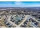 Wide aerial view of a suburban neighborhood with ponds and neatly arranged homes under a clear sky at 377 Morningside Dr, Brownsburg, IN 46112