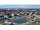 This is an aerial view showcasing a pond with homes and neighborhood landscape at 377 Morningside Dr, Brownsburg, IN 46112