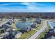 Aerial view of a suburban neighborhood with ponds and neatly arranged homes under a clear sky at 377 Morningside Dr, Brownsburg, IN 46112