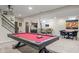 Spacious finished basement features a pool table, bar area, and ample entertaining space at 377 Morningside Dr, Brownsburg, IN 46112