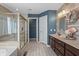 Stylish bathroom features double vanity, step-in shower, and soaking tub, offering a spa-like experience at 377 Morningside Dr, Brownsburg, IN 46112