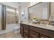 Bathroom with a double vanity, framed mirror, and shower-tub combination at 377 Morningside Dr, Brownsburg, IN 46112