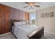 Bedroom with a wooden bed frame and decorative accent wall at 377 Morningside Dr, Brownsburg, IN 46112