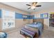 Cozy bedroom featuring a plush bed, striped accent wall, and plenty of natural light at 377 Morningside Dr, Brownsburg, IN 46112