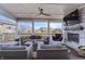 Comfortable outdoor living space with a fireplace, egg chair, and stylish seating for relaxing and entertaining at 377 Morningside Dr, Brownsburg, IN 46112