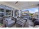 Relaxing covered patio featuring cozy armchairs, comfortable sofas, and an outdoor bar for entertaining at 377 Morningside Dr, Brownsburg, IN 46112