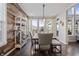 Bright dining area featuring elegant wood accent wall and contemporary lighting at 377 Morningside Dr, Brownsburg, IN 46112
