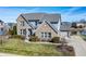 Two-story home with brick and stone accents, a manicured lawn, and an attached garage at 377 Morningside Dr, Brownsburg, IN 46112