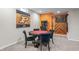 Basement game room featuring a poker table, dart board, and arcade game for hours of entertainment at 377 Morningside Dr, Brownsburg, IN 46112