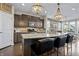 Stylish kitchen with a spacious granite island, stainless steel appliances, and pendant lights at 377 Morningside Dr, Brownsburg, IN 46112