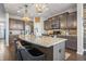 Beautiful kitchen with a large island, stainless steel appliances, and modern lighting at 377 Morningside Dr, Brownsburg, IN 46112