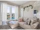 Inviting living room with a sectional sofa, large window, and a glimpse of the scenic backyard at 377 Morningside Dr, Brownsburg, IN 46112