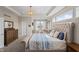 Stylish main bedroom with a bed, dresser, and relaxing sitting area at 377 Morningside Dr, Brownsburg, IN 46112