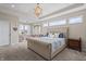 Cozy main bedroom with large bed, sitting area, and natural light at 377 Morningside Dr, Brownsburg, IN 46112