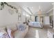 Comfortable main bedroom with a bed, sitting area, and ensuite bathroom at 377 Morningside Dr, Brownsburg, IN 46112