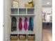 Mud room with built-in storage, coat hooks, and shoe baskets at 377 Morningside Dr, Brownsburg, IN 46112