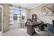 This home office is spacious with carpet flooring and features an office desk and chair at 377 Morningside Dr, Brownsburg, IN 46112