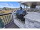 Outdoor kitchen with a primo grill and countertop space that overlooks the covered patio and water at 377 Morningside Dr, Brownsburg, IN 46112