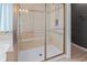 A spacious step-in shower features stylish glass doors and tile surround at 377 Morningside Dr, Brownsburg, IN 46112