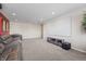 Spacious theater room featuring a large projector screen, comfortable seating and neutral color scheme at 377 Morningside Dr, Brownsburg, IN 46112
