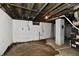 Unfinished basement with concrete walls and open ceiling at 3910 E 34Th St, Indianapolis, IN 46218