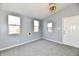 Bedroom with three windows, gray paint and gray carpeting at 3910 E 34Th St, Indianapolis, IN 46218