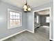 Dining room featuring access to other rooms, and a big window for lots of natural light at 3910 E 34Th St, Indianapolis, IN 46218