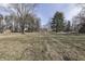 Large backyard with mature trees and open space at 5324 Mann Rd, Indianapolis, IN 46221