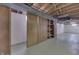 Unfinished basement offering storage and built-in shelving at 5324 Mann Rd, Indianapolis, IN 46221