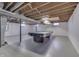 Finished basement with a pool table and overhead lighting at 5324 Mann Rd, Indianapolis, IN 46221