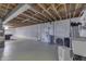Unfinished basement with high ceilings and plenty of storage space at 5324 Mann Rd, Indianapolis, IN 46221