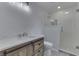 Modern bathroom with a walk-in shower and updated vanity at 5324 Mann Rd, Indianapolis, IN 46221