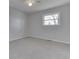 Simple bedroom with neutral walls, carpet, and a ceiling fan at 5324 Mann Rd, Indianapolis, IN 46221