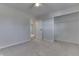 Bright bedroom with neutral walls, carpet, and a spacious closet at 5324 Mann Rd, Indianapolis, IN 46221