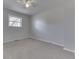 Simple bedroom with neutral walls, carpet, and a window at 5324 Mann Rd, Indianapolis, IN 46221