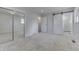Spacious bedroom with mirrored closet doors and barn door to bathroom at 5324 Mann Rd, Indianapolis, IN 46221