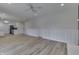 Open concept dining room with wood floors and kitchen views at 5324 Mann Rd, Indianapolis, IN 46221
