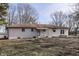 Back of the house showing a patio and landscaping at 5324 Mann Rd, Indianapolis, IN 46221