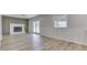 Gathering room with fireplace, wood floors and french doors to backyard at 5324 Mann Rd, Indianapolis, IN 46221