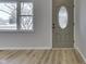 Light and airy interior with new flooring and a view of the backyard at 5324 Mann Rd, Indianapolis, IN 46221