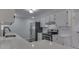 Modern kitchen featuring white cabinets, stainless steel appliances, and quartz countertops at 5324 Mann Rd, Indianapolis, IN 46221