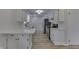 Modern kitchen with white shaker cabinets and stainless steel appliances at 5324 Mann Rd, Indianapolis, IN 46221