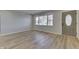 Spacious living room with hardwood floors and a view of the front yard at 5324 Mann Rd, Indianapolis, IN 46221