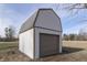 Detached storage shed with a garage-style door at 5324 Mann Rd, Indianapolis, IN 46221