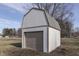 Detached storage shed with a garage-style door at 5324 Mann Rd, Indianapolis, IN 46221